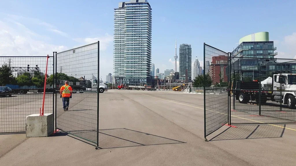 Construction site access control with fencing and Toronto skyline